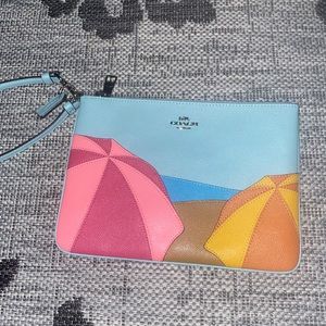 coach gallery pouch with umbrella motif
